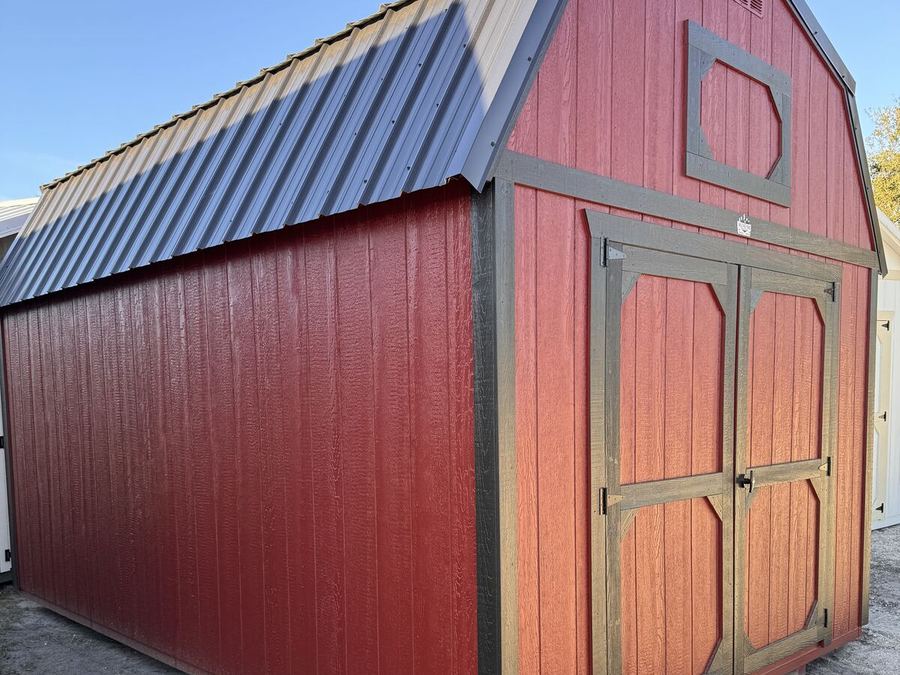 Red lofted barn with dark trim