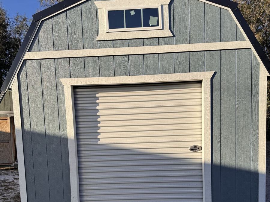 Lofted barn garage with roll-up door