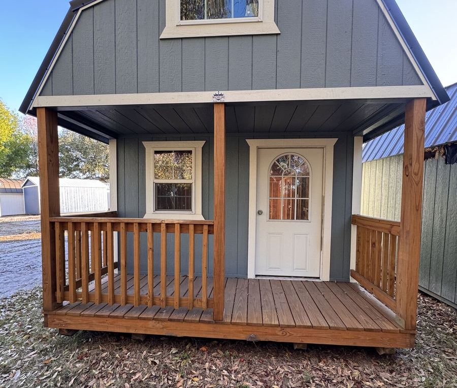 Lofted barn cabin with a wooden front porch, hand-built and delivered in Southwest Florida