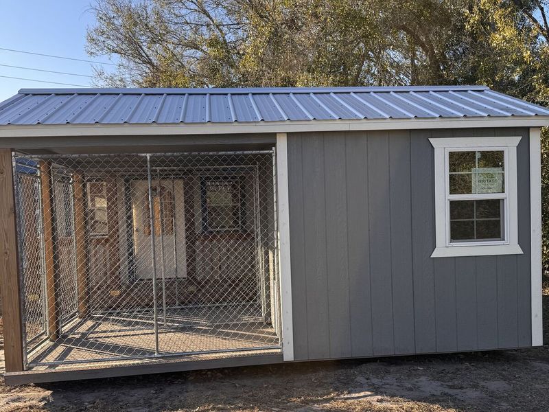 Dog kennel with covered run — built by Yoder Storage Barns