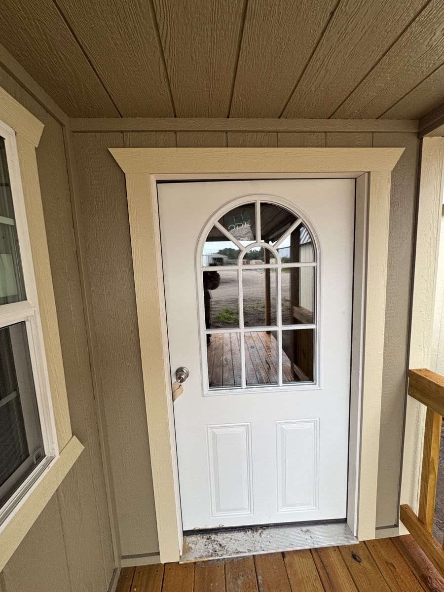 The in-swing door with glass in it