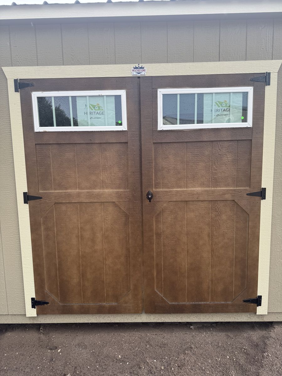 A pane set into each of a pair of wooden doors — these ones stained rather than painted