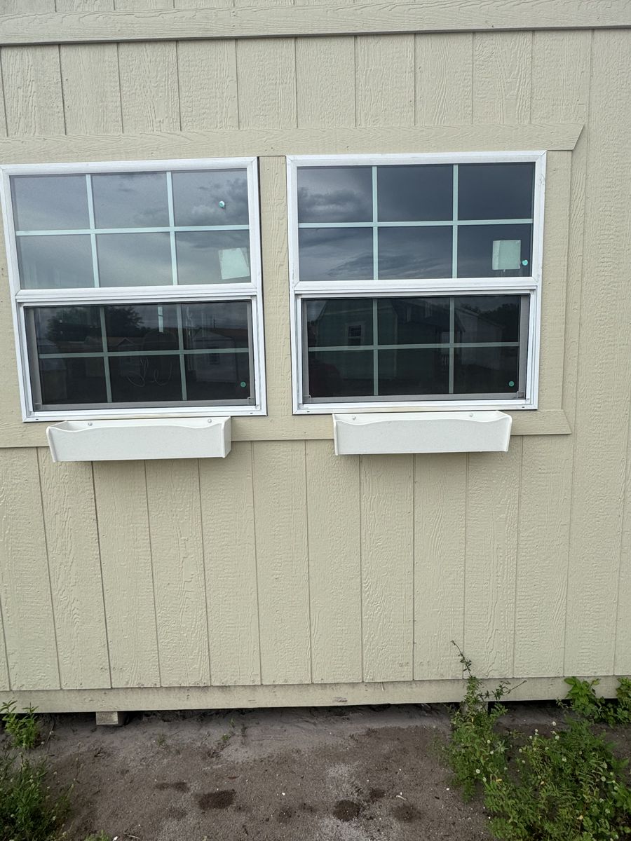 Flower boxes under a pair of windows