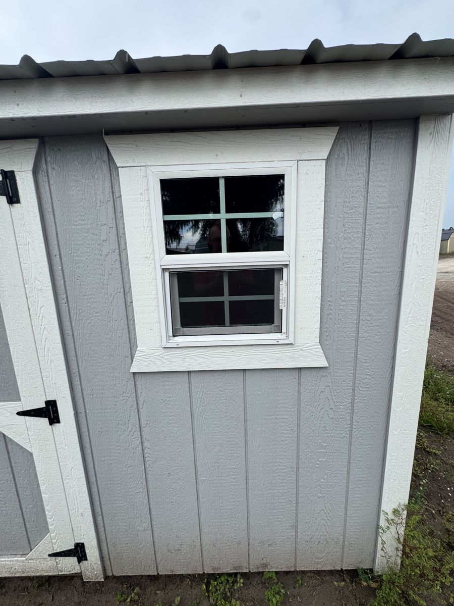 The gable window, up above the doors