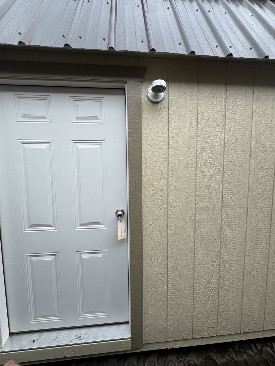 The same light beside a steel door