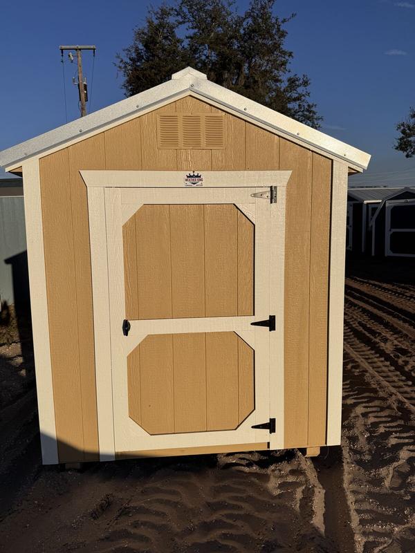 Tan utility shed